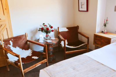 two chairs with Roses on table