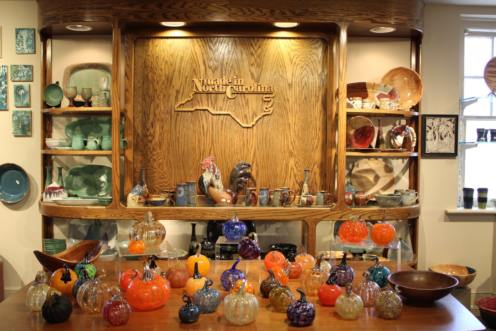Handblown glass pumpkins and North Carolina pottery in a shop in Historic Biltmore Village, Asheville Handblown glass pumpkins and North Carolina pottery in a shop in Historic Biltmore Village, Asheville
