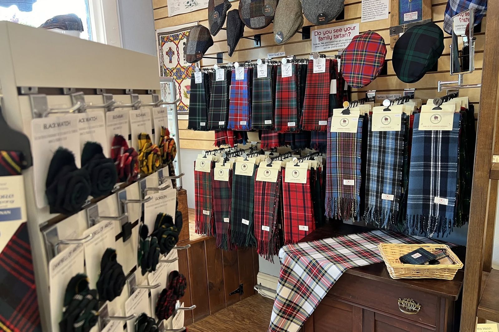 black-mountain-tartan-shop Tartan scarves, wool flat caps, and clan brooches on display in a shop in downtown Black Mountain