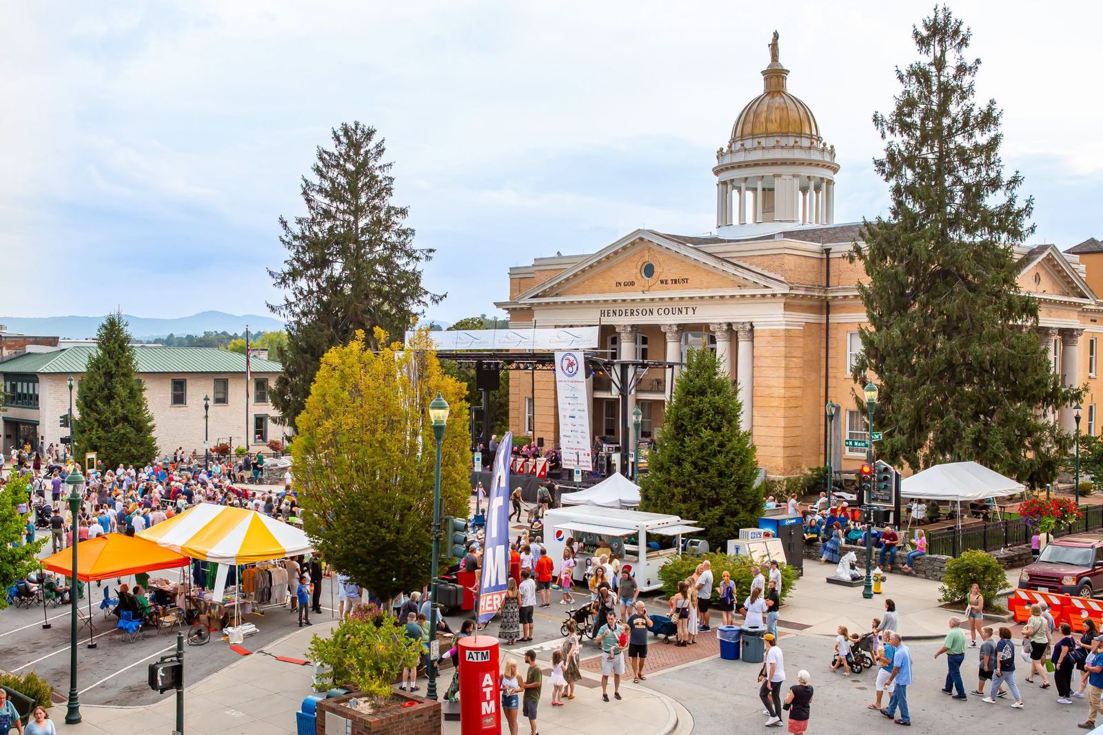 hendersonville-main-street-courthouse Crowds and vendor tents on Main Street in front of the gold-domed Henderson County Courthouse in Hendersonville