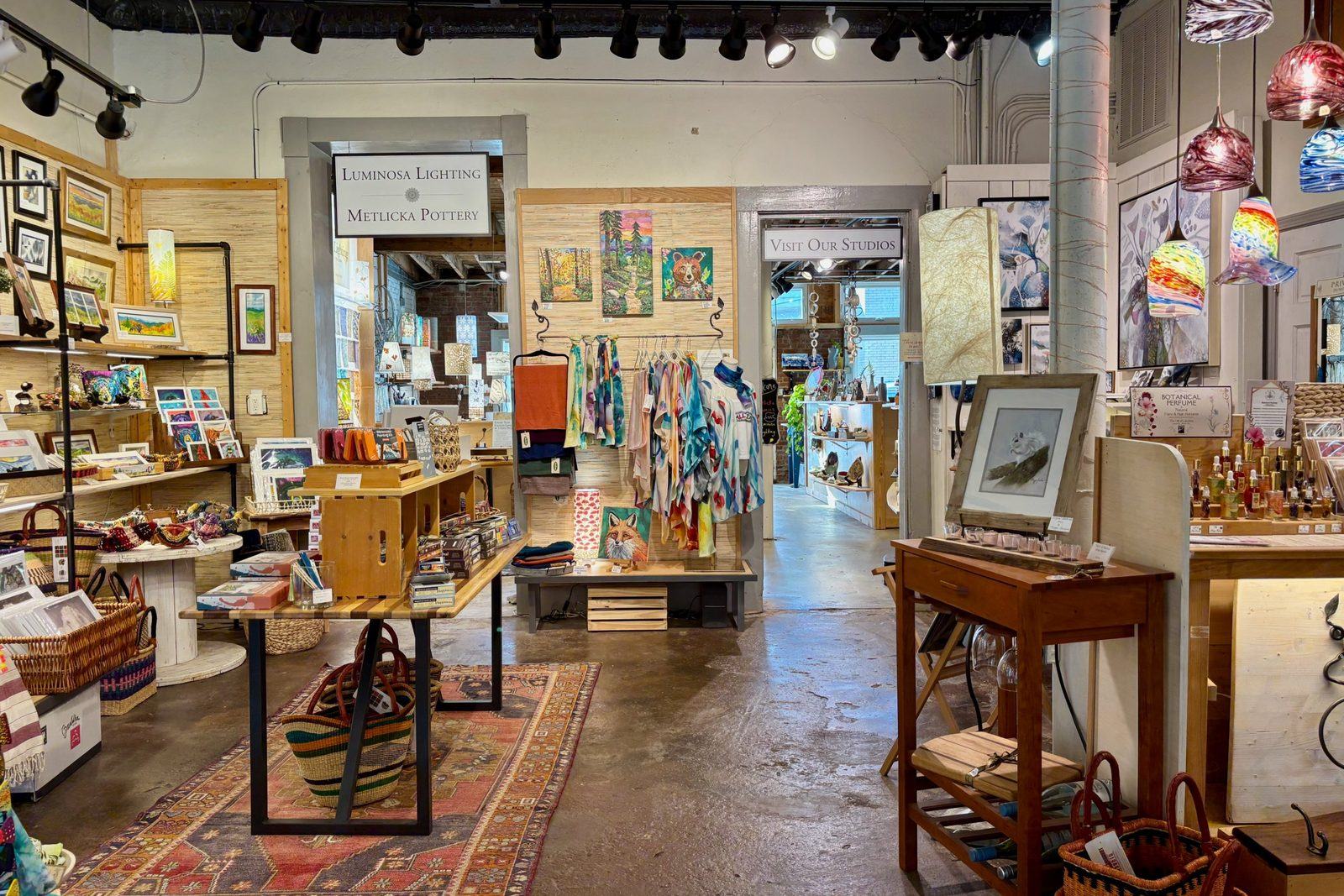 weaverville-artisans-on-main-gallery Hand-dyed scarves, paintings, and glass pendant lights inside Artisans on Main in Weaverville